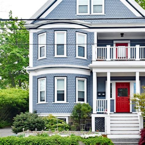 blue house red metal roof|blue houses with red doors.